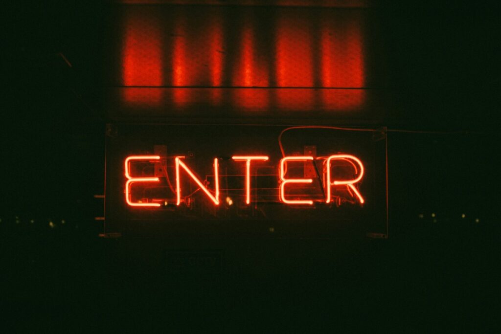 Neon sign saying 'Enter'